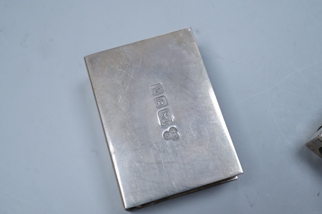 A George V engraved silver cigarette case, Birmingham, 1930, 82mm, a similar silver vesta case, London, 1913 and two silver matchbox sleeves.